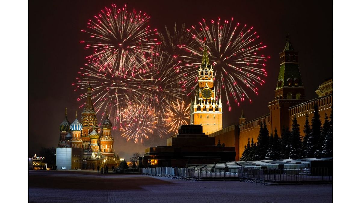Fireworks explode over the the St. Basil's Cathedral and the Kremlin with the Spasskaya Tower on empty Red Square due to pandemic restrictions during New Year's celebrations, in Moscow, Russia. Credit: Reuters Photo