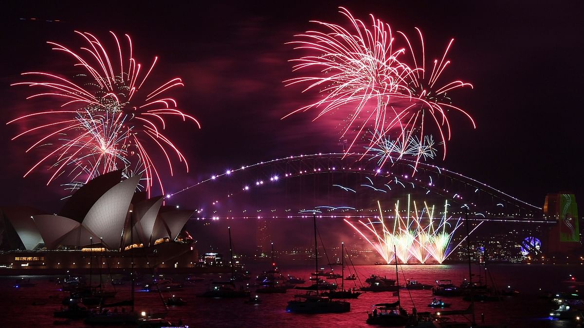 Fireworks explode over the Sydney Opera House and Harbour Bridge as New Year's Eve celebrations begin in Sydney. Credit: AFP Photo