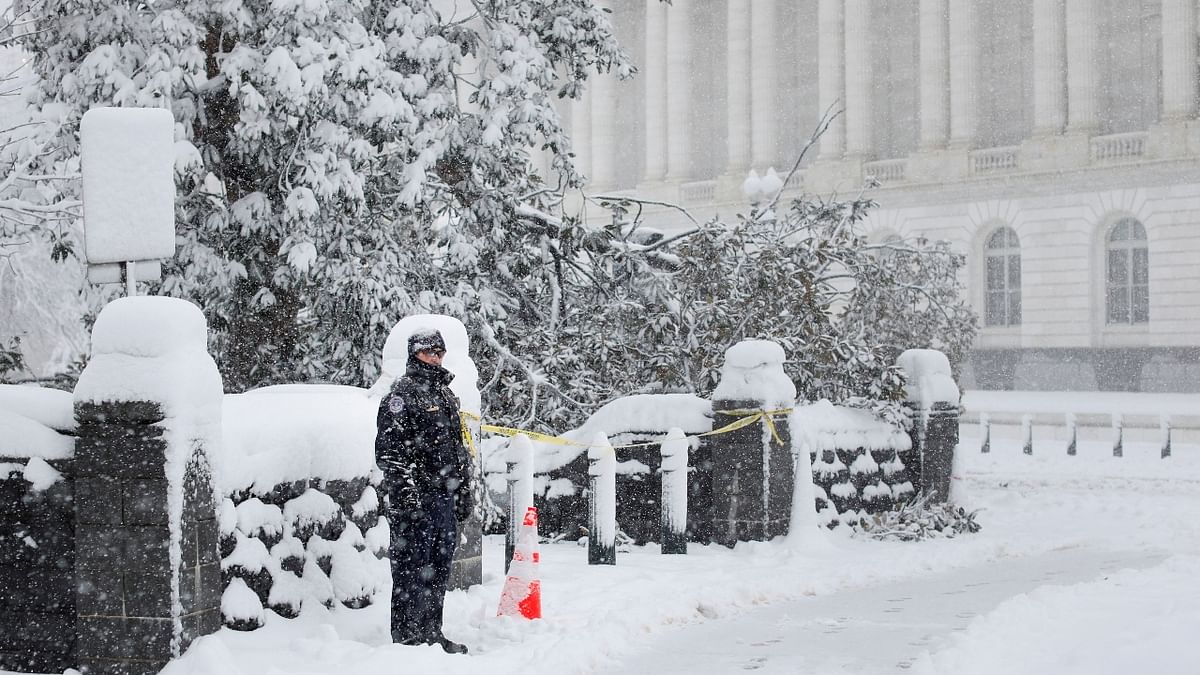 Even the Federal government offices and schools in the Washington DC area were closed as the region received its first significant snowfall of the season. In this photo, a US Capitol Police Officer is seen standing guard amid a snow storm on Capitol Hill in Washington. Credit: Reuters Photo