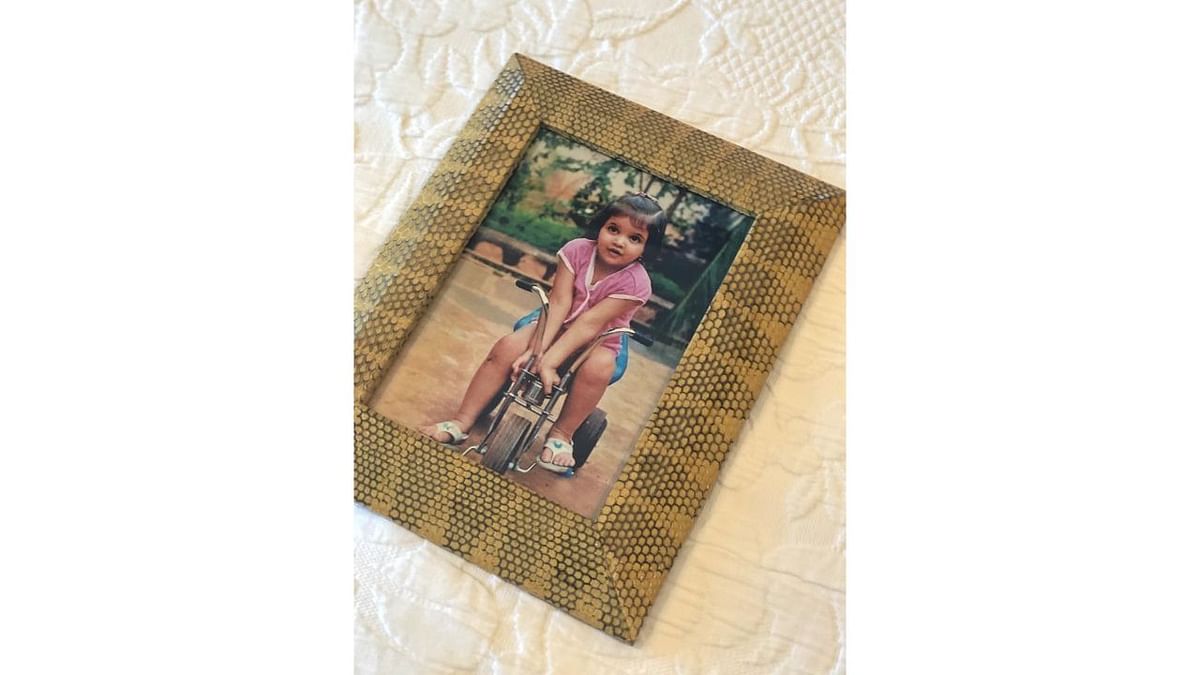 Deepika riding her tricycle. Credit: Instagram/deepikapadukone