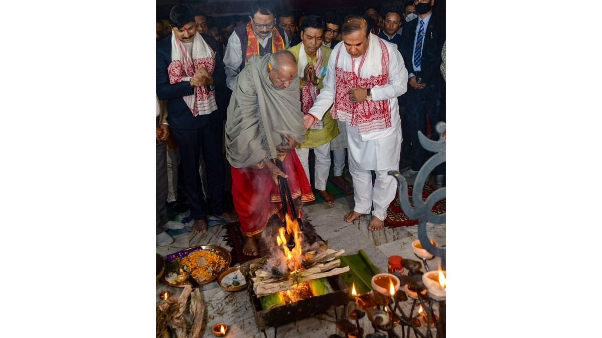 Assam Chief Minister Himanta Biswa Sarma and Assam BJP President Bhabesh Kalita perform pooja during a ceremony for the well-being of Prime Minister Narendra Modi, in Guwahati. Credit: PTI Photo