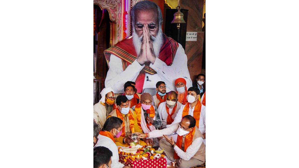 Madhya Pradesh Chief Minister Shivraj Singh Chouhan performs a puja during a ceremony organised for the long life of Narendra Modi at a temple in Bhopal. Credit: PTI Photo