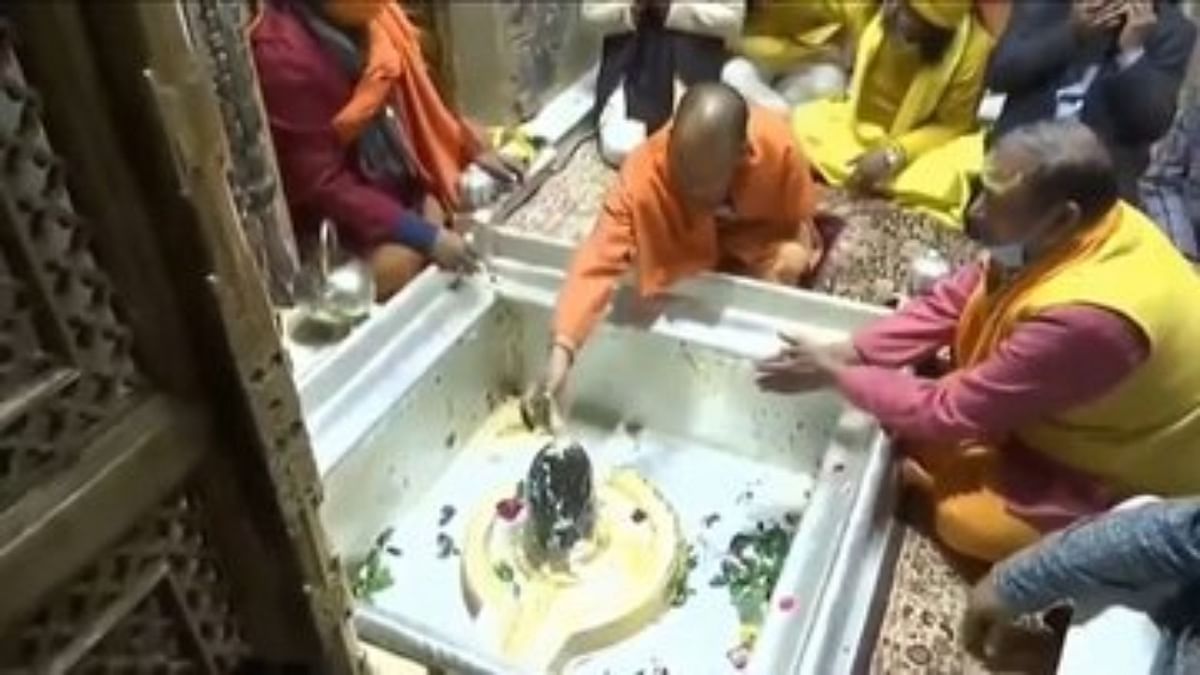 Uttar Pradesh Chief Minister Yogi Adityanath is seen offering prayers at a temple a day after PM Modi's security was breached during his visit to Punjab. Credit: Twitter/@myogiadityanath