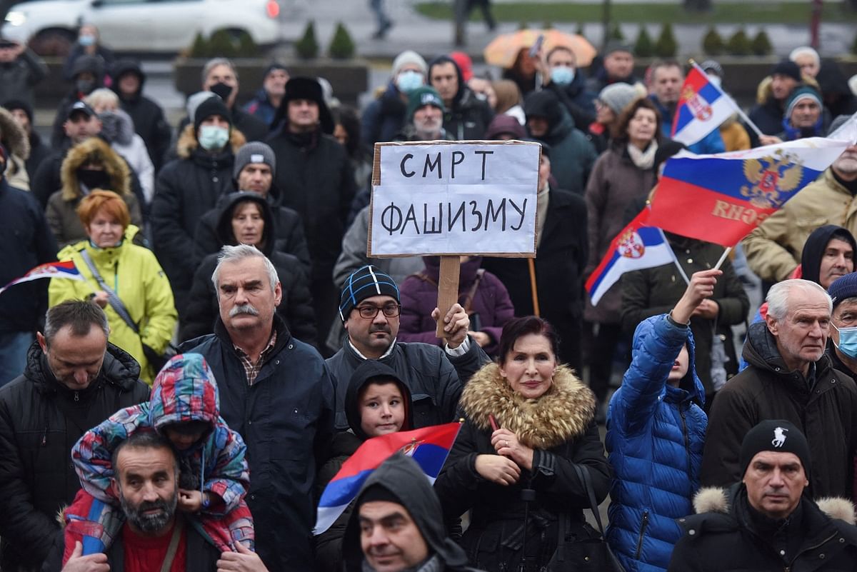 A supporter of Serbian tennis player Novak Djokovic holds a banner that reads: ''Death to Fascism'' during a protest in front of the National Assembly in Belgrade, Serbia. Credit: Reuters Photo