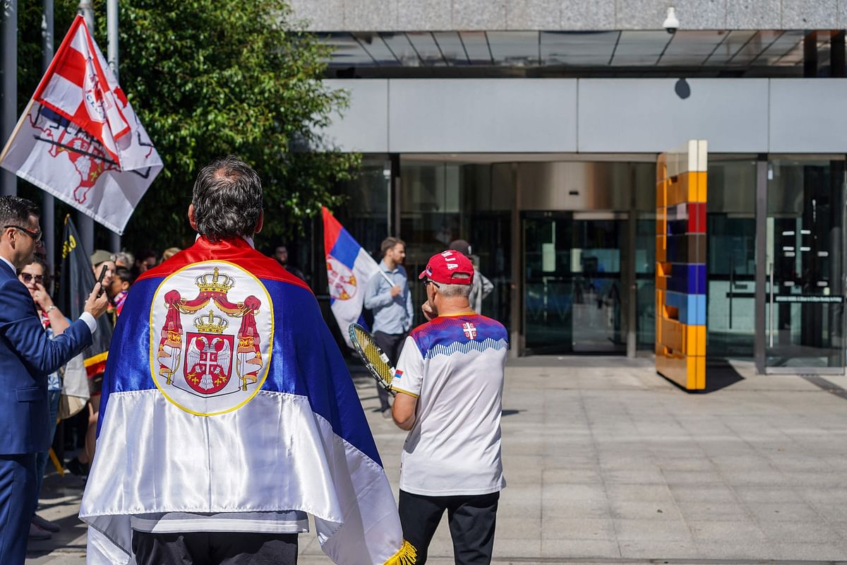 Supporters of Serbia's tennis player Novak Djokovic gather outside the Federal Court building in Melbourne. Credit: AFP Photo