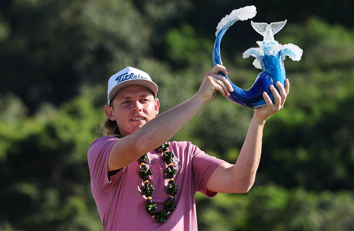 Cameron Smith of Australia celebrates with the trophy after winning during the final round of the Sentry Tournament of Champions at the Plantation Course at Kapalua Golf Club. Credit: AFP Photo