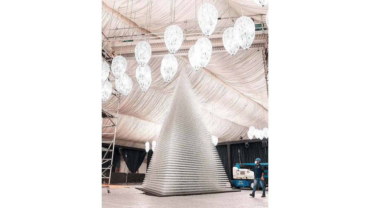 Reportedly, it took 54,740 champagne glasses and over 55 hours to create this 8.23-metre-high (27 feet high) tower, the world’s largest drinking glass tower of 2022. Credit: Instagram/maximecasa