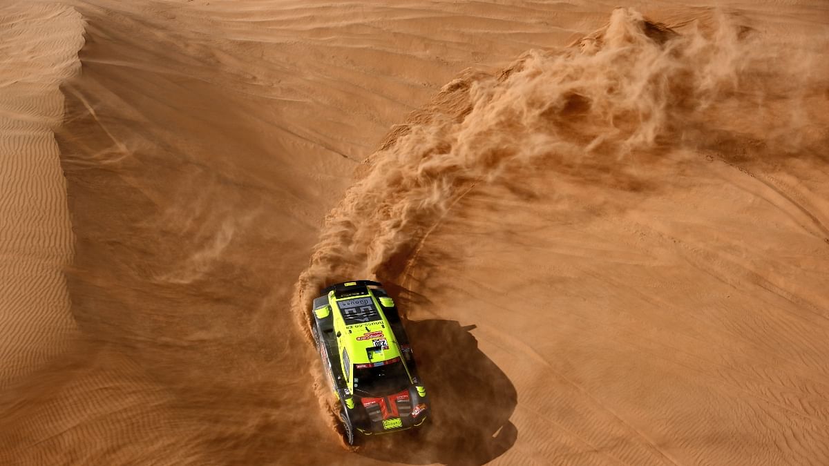 Lithuanian driver Brian Baragwanath and co-driver Leonard Cremer of South Africa compete during the Stage 8 of the Dakar Rally 2022 between al-Dawadimi and Wadi Ad-Dawasir in Saudi Arabia. Credit: AFP Photo