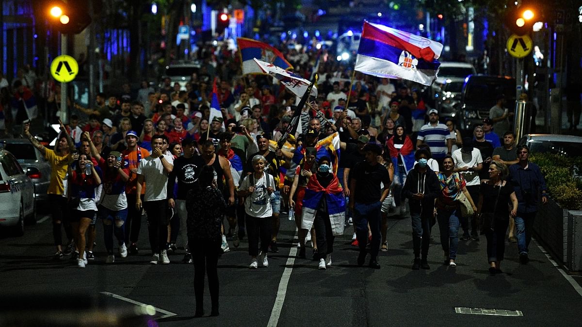 Members of the Serbian community are seen marching in support of tennis player Novak Djokovic in Melbourne, Australia. Credit: Reuters Photo