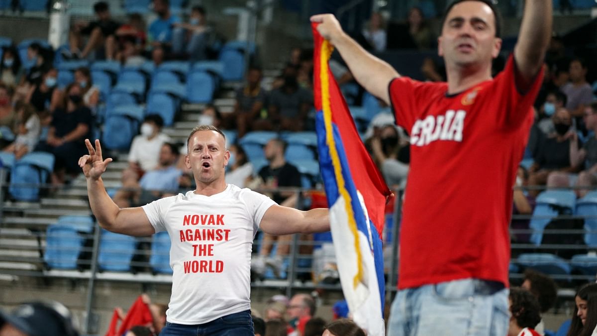 Serbia fans display their flag in support of Novak Djokovic during the group stage match in Sydney. Credit: Reuters Photo