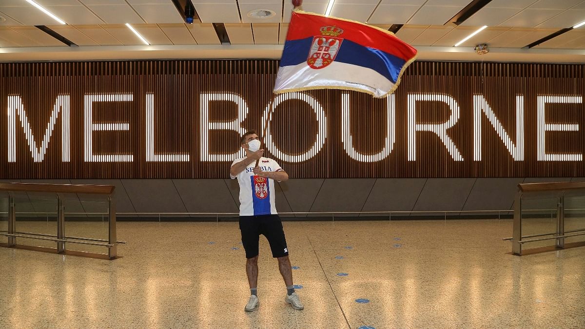 A fan of Serbia's Novak Djokovic in the arrivals hall at Melbourne Airport ahead of the Australian Open in Melbourne, Australia. Credit: AP/PTI Photo