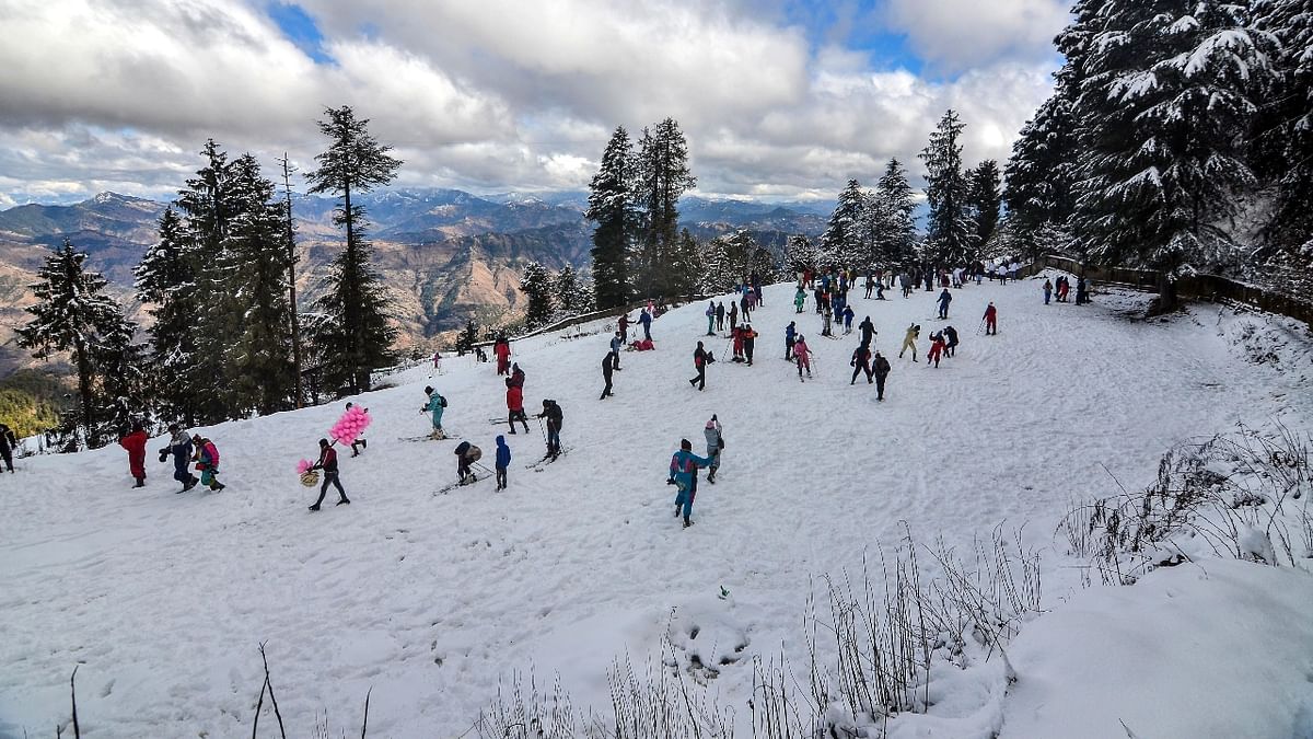 Tourists ski after fresh snowfall at Kufri near Shimla in Himachal Pradesh. Credit: PTI Photo