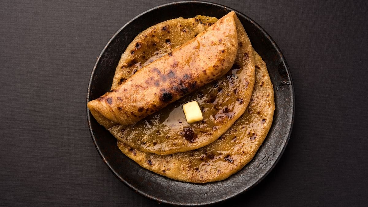 Puran Poli: An ambrosial concoction of sweet flatbread stuffed with sweet moong filling, Puran Poli is the perfect combination of taste and festival. Credit: Getty Images