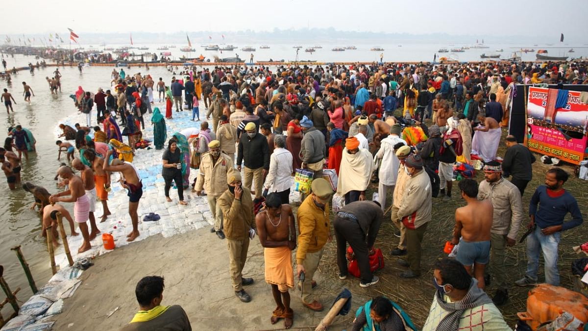 Hindu devotees gather to take a holy dip during Magh Mela festival in Prayagraj. Credit: Reuters Photo