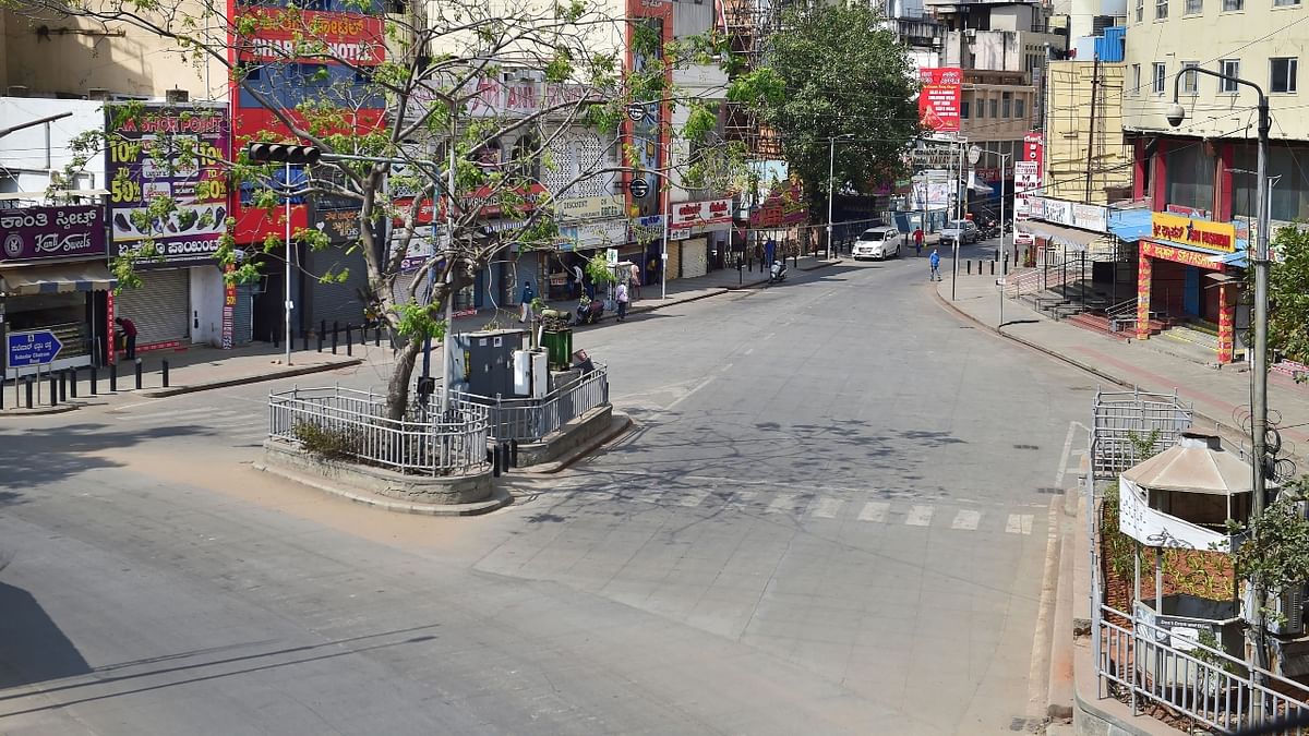 Empty roads, abandoned streets and no movement in public spaces were observed in Karnataka as the state went into 55-hour-long weekend curfew lockdown to contain the spread of coronavirus. Credit: PTI Photo