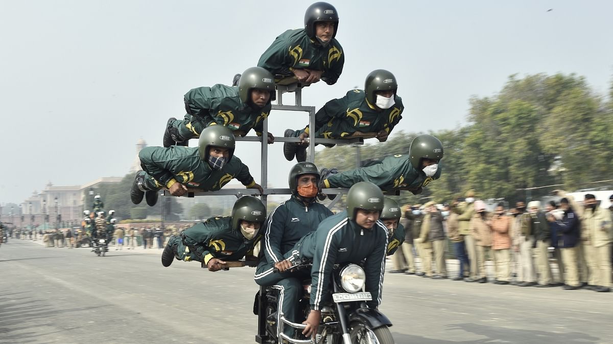 ITBP ‘daredevil' bikers team practice stunts during the rehearsal for the upcoming Republic Day parade on a cold winter morning in New Delhi. Credit: PTI Photo