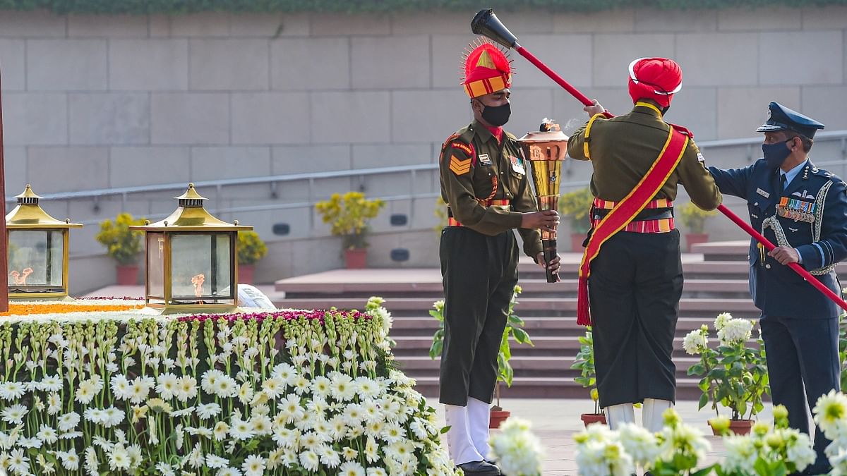 The Amar Jawan Jyoti, the eternal flame for soldiers at India Gate, was merged with the torch at the National War Memorial on January 21, 2022. Credit: PTI Photo