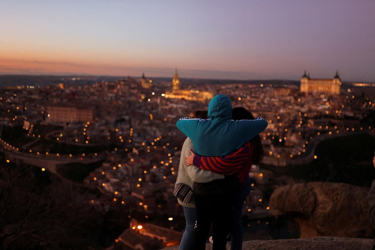 People look at the general view of Toledo city, after the Japan Convention Bureau (Yakei) in collaboration with the Japan Tourism Office of Spain, recognised the medieval city of Toledo with the most beautiful panoramic view of the world at night, near Madrid, Spain. Credit: Reuters Photo
