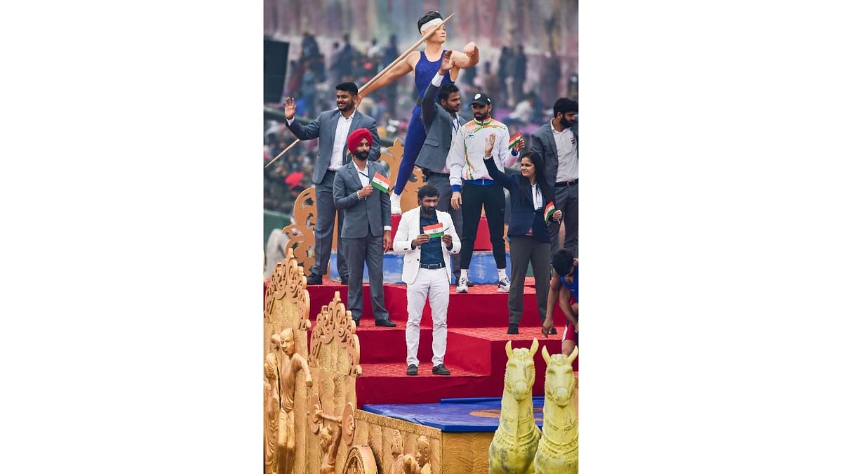 Olympics medallist wrestler Yogeshwar Dutt with other sportspersons at Haryana tableau, during the full dress rehearsal of the Republic Day parade 2022, at Rajpath in New Delhi. Credit: PTI Photo