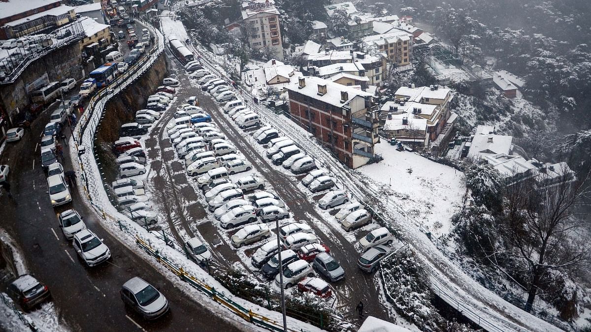 Reportedly, the upper areas in Shimla district like Jubbal, Narkanda and Kharapathar experienced moderate to heavy snowfall. Credit: PTI Photo