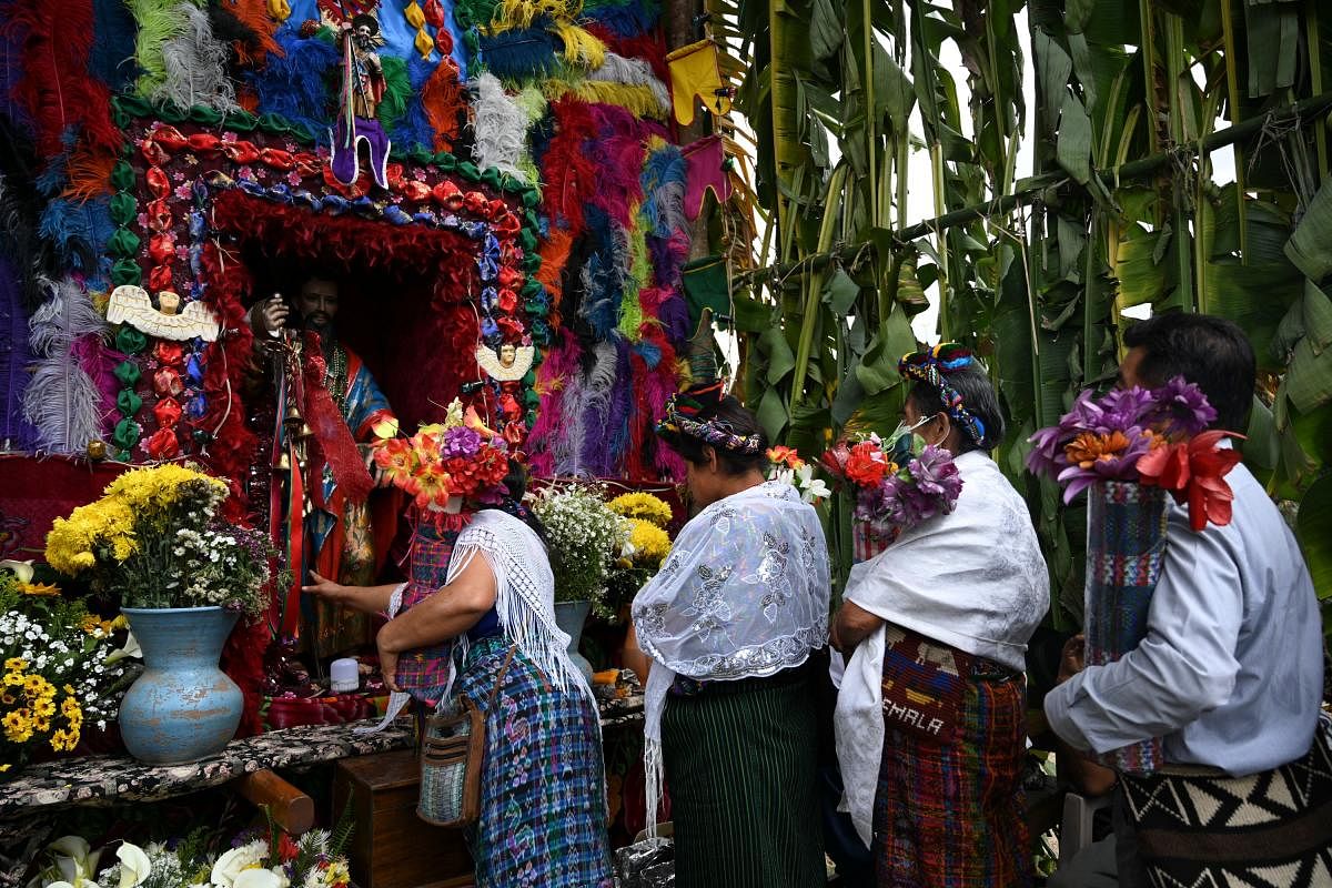 Dressed in colorful costumes and masks, Guatemalan indigenous went into the streets this Sunday in a municipality in northern Guatemala to perform to the sound of music the Rabinal Achí, a dance theater with pre-Hispanic Mayan roots declared a World Heritage Site. Credit: AFP Photo