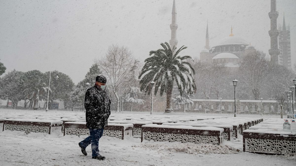 A local resident walks in the Sultanahmet Square next to the Sultan Ahmet Mosque, known as the Blue Mosque, in Istanbul. Credit: AFP Photo