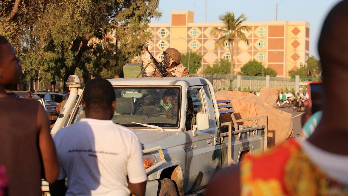 An army soldier rides a truck after the deposition of President Kabore in Ouagadougou, Burkina Faso. Credit: Reuters Photo