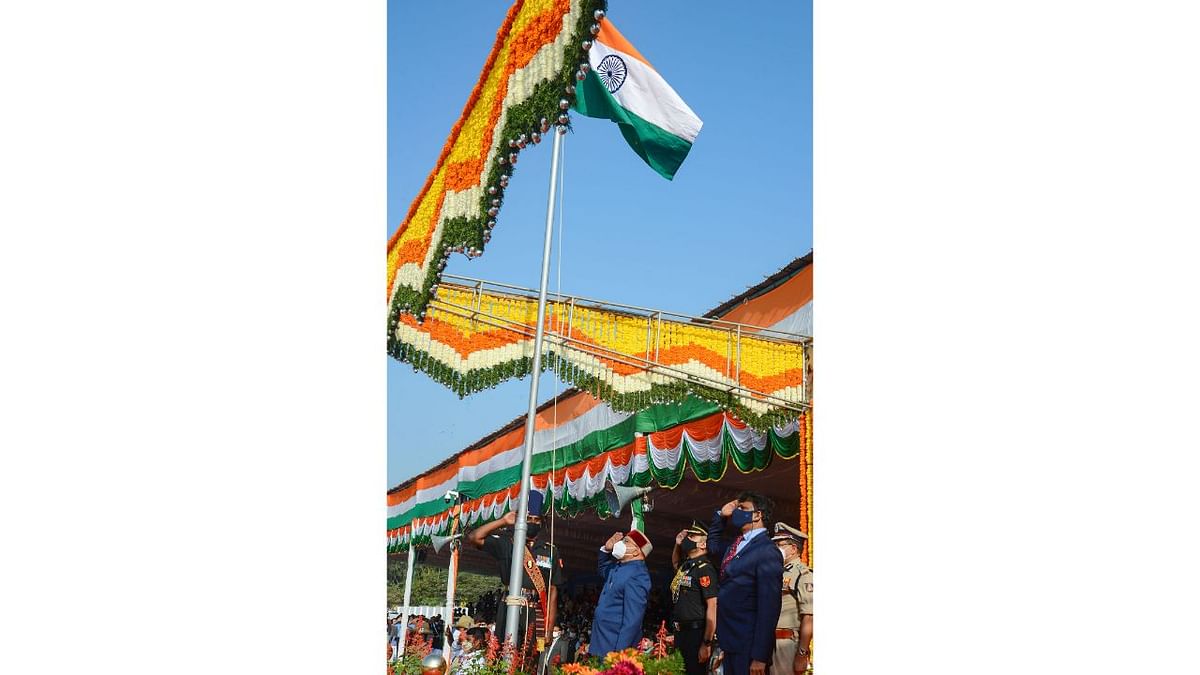 Karnataka Governor Thawar Chand Gehlot salutes after unfurling the National Flag at Manekshaw Parade Ground in Bengaluru. Credit: PTI Photo
