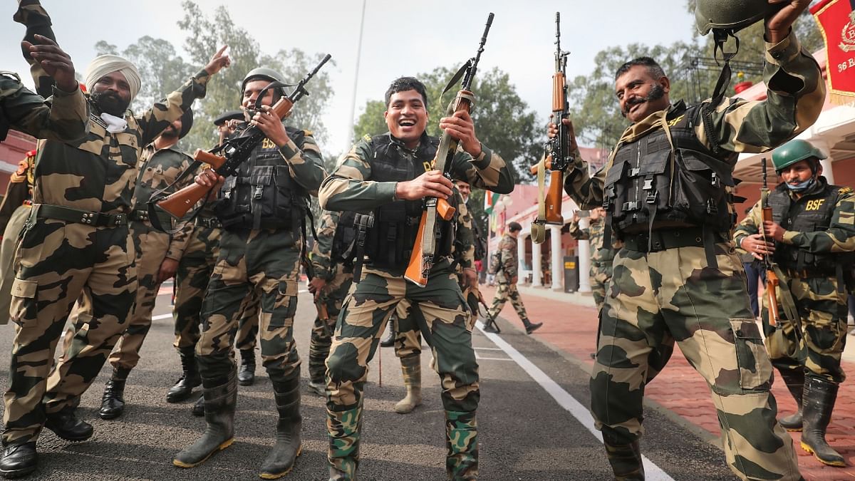Border Security Force (BSF) soldiers dance during Republic Day celebrations at Octroi Post on Indo-Pak international border in Suchetgarh on the outskirts of Jammu. Credit: PTI Photo