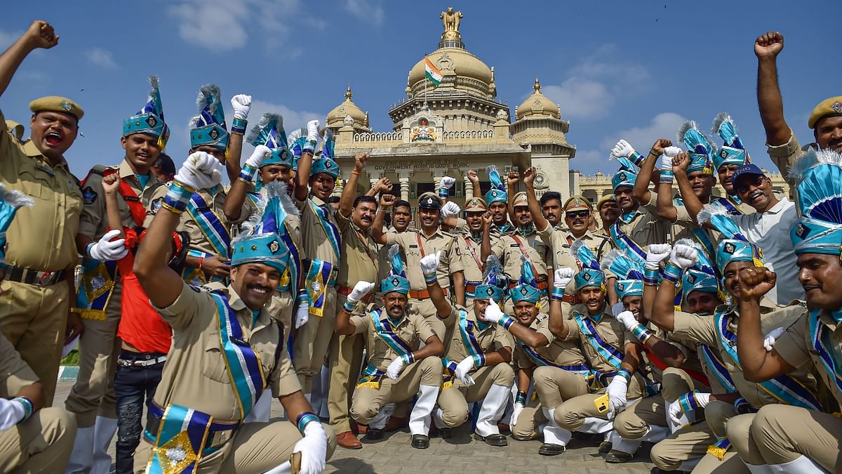 Andhra Pradesh Special Police personnel click a group selfie in front of Vidhana Soudha after the ceremonial Republic Day Parade 2022 at Manekshaw Parade Ground in Bengaluru. Credit: PTI Photo