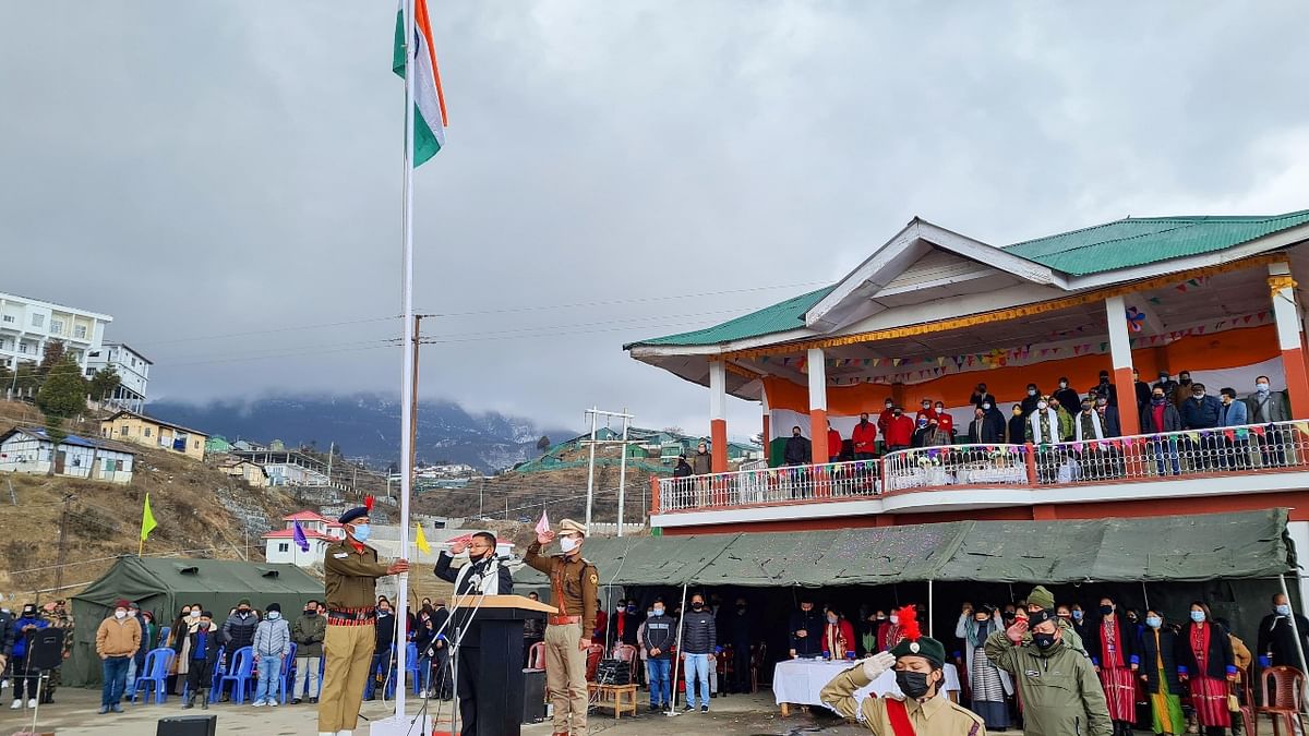 Deputy Commissioner of Tawang KN Damo unfurls the national flag during the 73rd Republic Day celebrations at General Parade Ground in Tawang. Credit: PTI Photo
