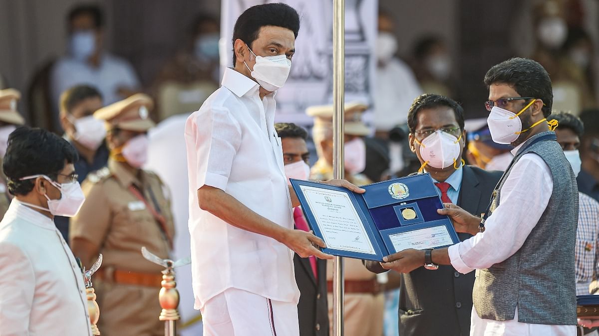 Tamil Nadu Chief Minister M K Stalin presents the Kottai Ameer Communal Harmony Award to activist J Mohammed Rafi of Coimbatore district during the Republic Day Parade 2022 at Marina Beach in Chennai. Credit: PTI Photo