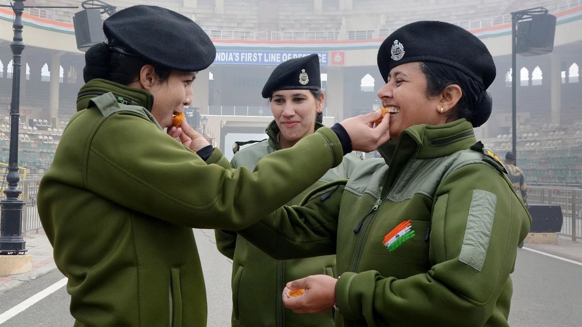Border Security Force (BSF) personnel exchange sweets during 73rd Republic Day celebrations at the India-Pakistan Attari-Wagah border, around 32 kms from Amritsar. Credit: PTI Photo