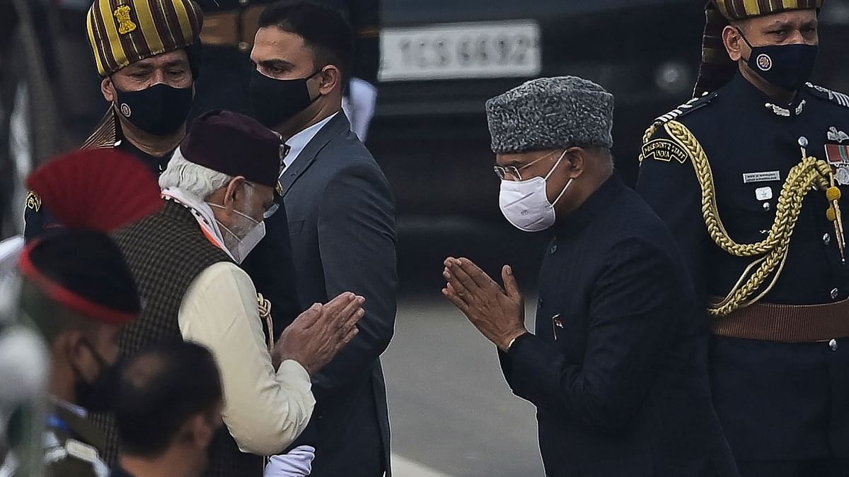 Prime Minister Narendra Modi and President Ram Nath Kovind exchange greetings as they arrive to attend Republic Day parade at the Rajpath in New Delhi. Credit: AFP Photo