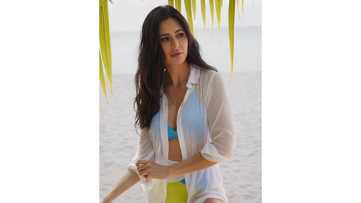 In one of the posts, Katrina was seen in a blue bikini top and a high-rise bottom paired with a white mesh shirt. Credit: Instagram/katrinakaif