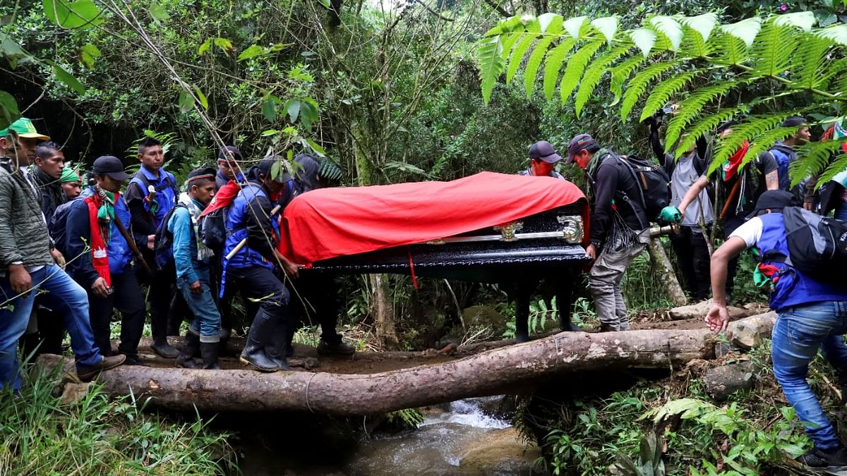 Indigenous people from the Nasa tribe attend the funeral of Albeiro Camayo, former regional coordinator of the National Indigenous Guard, assassinated by dissidents of the Revolutionary Armed Forces of Colombia (FARC). Credit: Reuters Photo