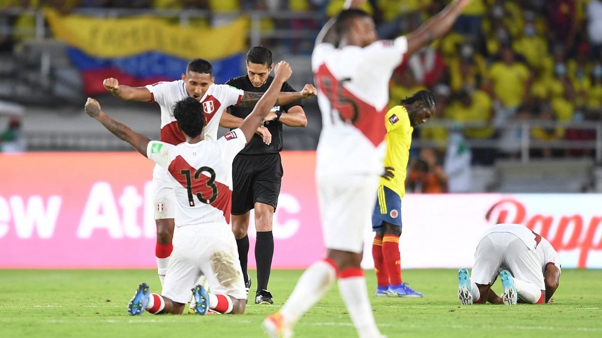 Peru's players react after defeating Colombia on the South American qualification football match for the FIFA World Cup Qatar 2022 at the Roberto Melendez Metropolitan Stadium in Barranquilla, Colombia. Credit: AFP Photo