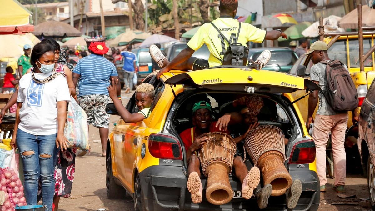 A man drives a car at the Mvog Ada market in Yaounde, Cameroon. Credit: Reuters photo
