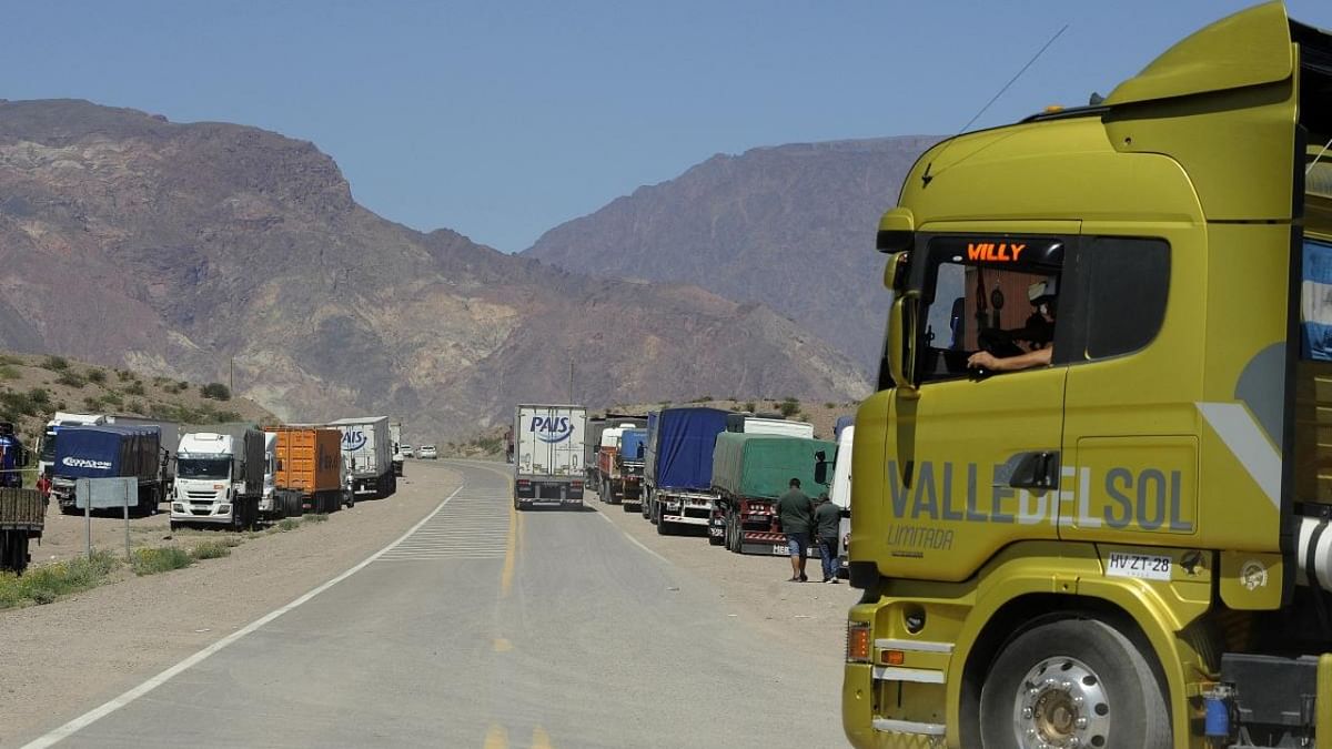 Trucks leave Argentina's customs complex in Uspallata, Mendoza province, metres from the Argentine customs office, before the Cristo Redentor-Libertadores international crossing between Argentina and Chile. Credit: AFP Photo