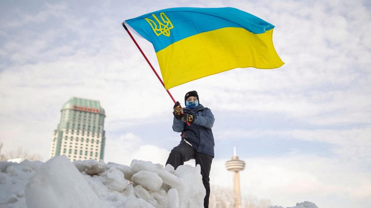 A boy waves a Ukrainian flag during a rally in support of Ukraine and against Russia, in Niagara Falls, Canada. Credit: Reuters photo