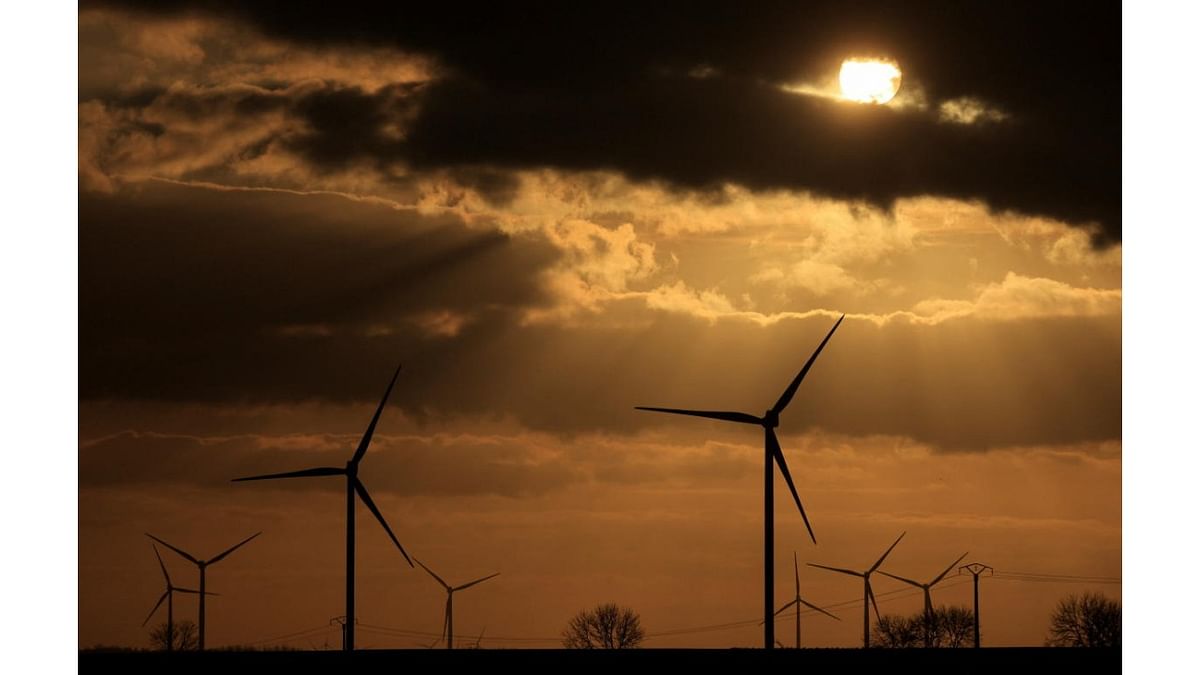 Power-generating windmill turbines are pictured at sunset at a wind park in Ecoust-Saint-Mein, near Cambrai, France. Credit: Reuters photo
