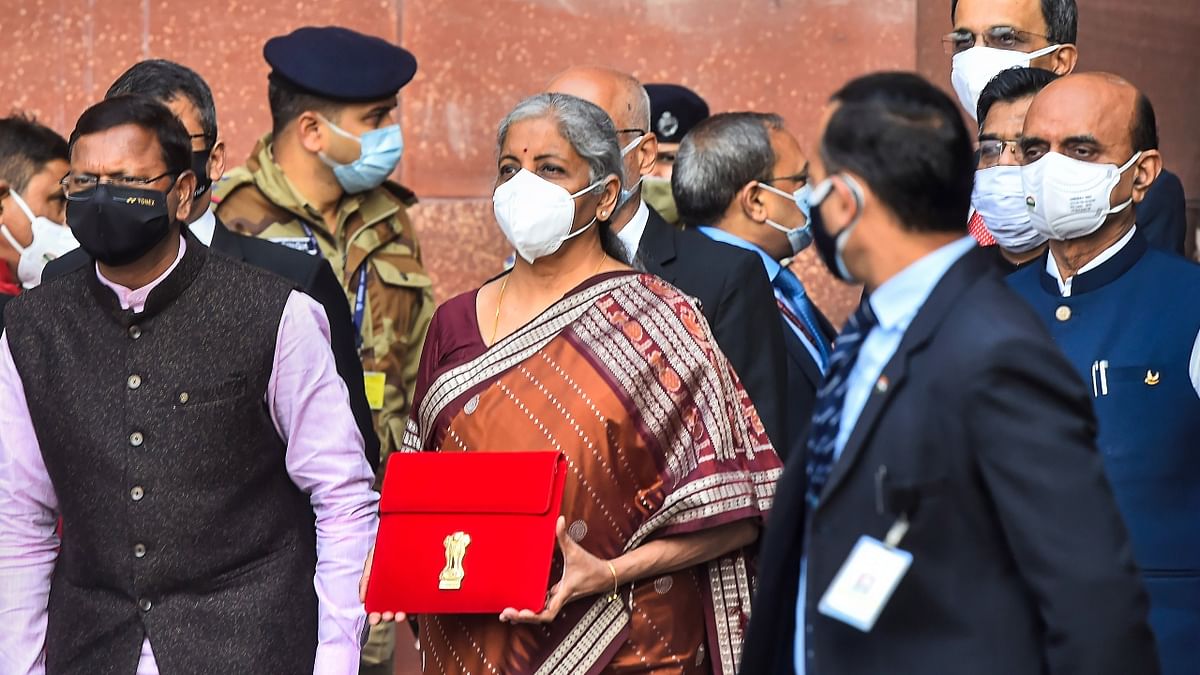 FM Sitharaman ditched her signature 'bahi-khata' and was seen carrying a tablet wrapped in a red cover with national emblem embossed on it. Credit: PTI Photo