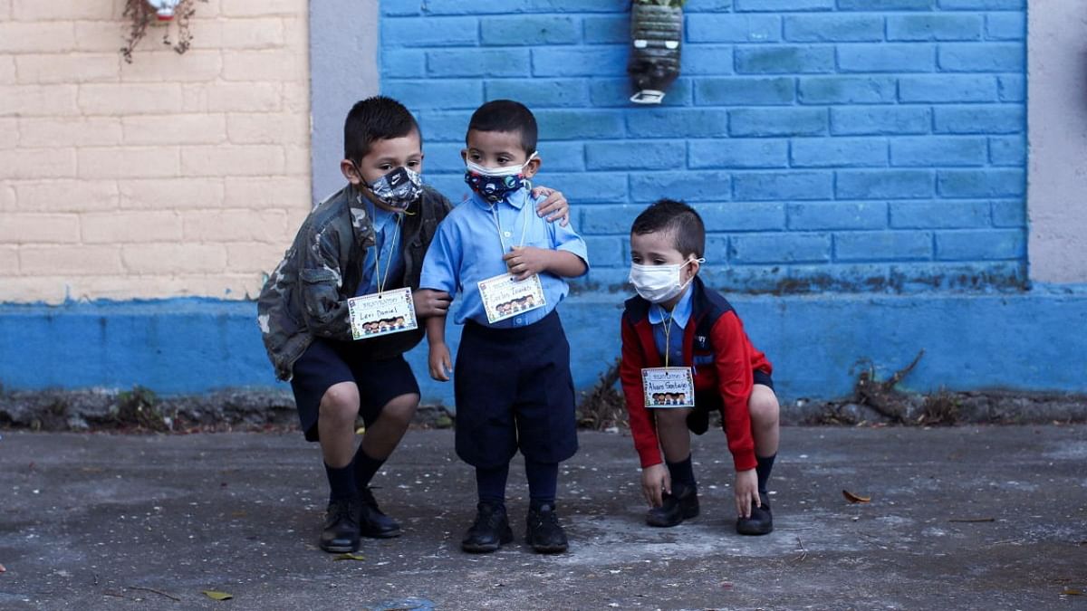 Students play during a lesson, as they return to classes for 2022 school year, amid the Covid-19 pandemic, in San Salvador. Credit: Reuters photo