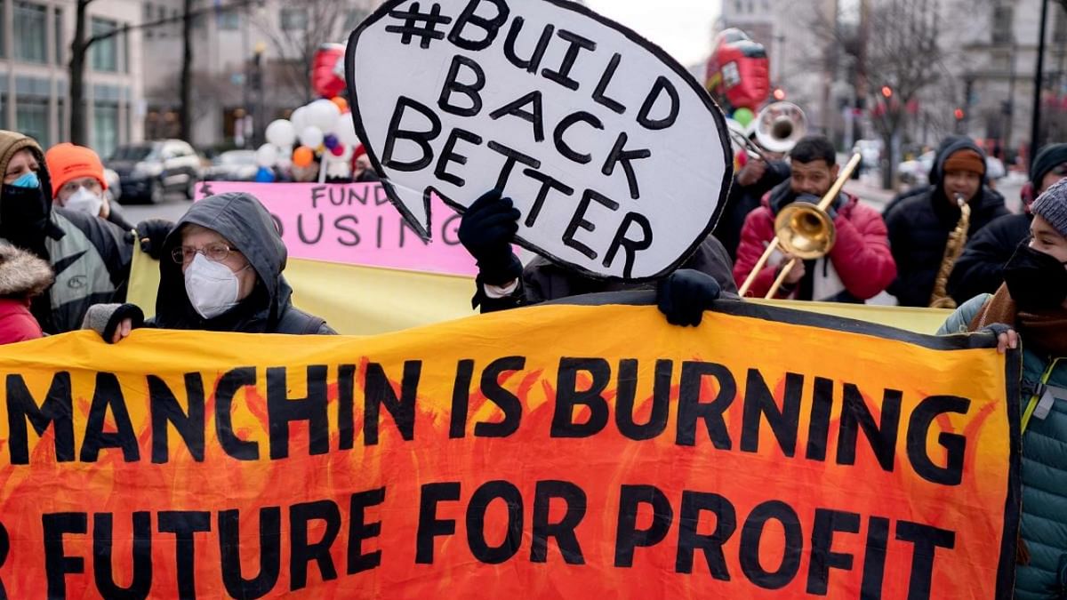 Activists participate in a rally for the Build Back Better legislation during morning rush hour in Washington, DC. Credit: AFP Photo