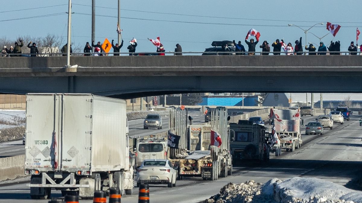 Protesting against government's vaccine mandates, hundreds of trucks and thousands of protesters blocked the streets in Ottawa, Canada. Credit: AFP Photo