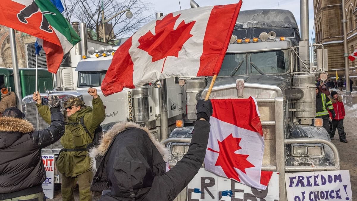 Outside Parliament, the mass protest led by Canadian truckers opposed to vaccine mandates for crossing the Canada-US border continued for a third day. Credit: AFP Photo