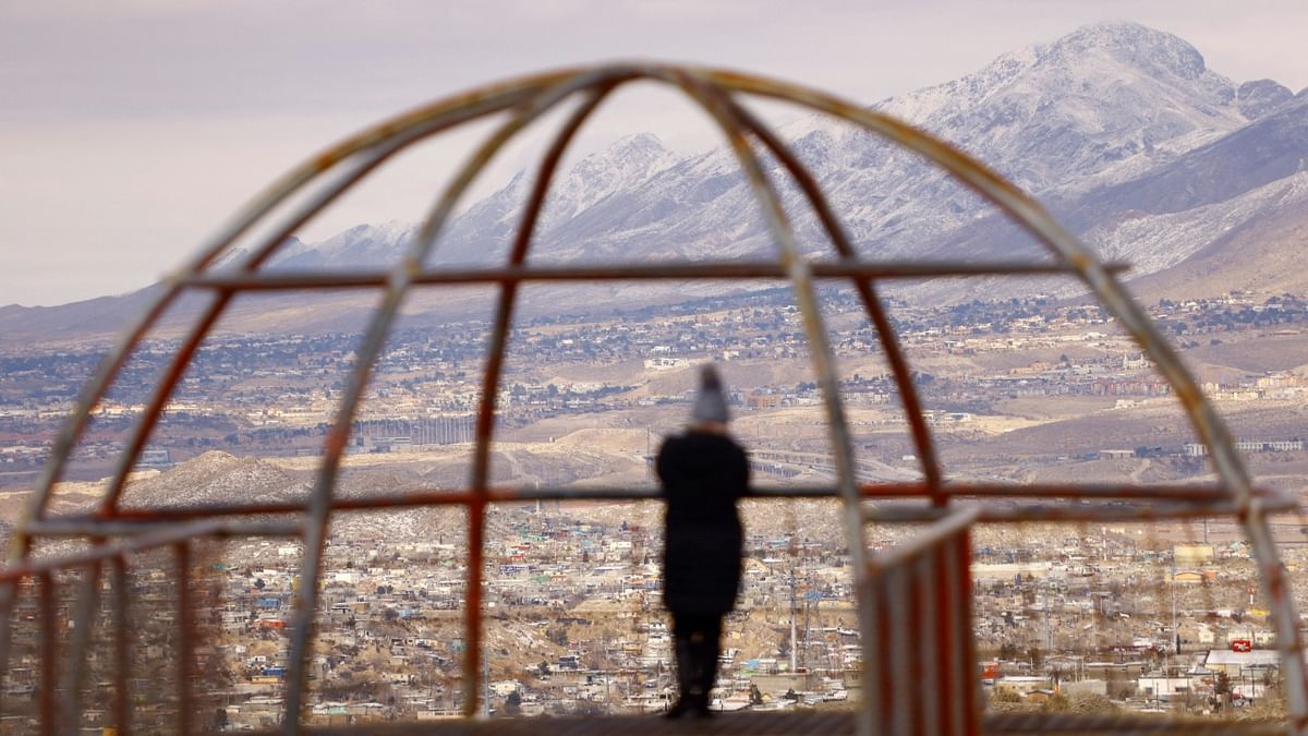 A woman watches from a viewpoint after a winter storm in Ciudad Juarez, Mexico. Credit: Reuters Photo
