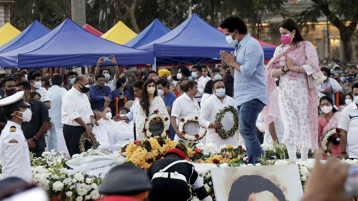 Cricketer Sachin Tendulkar and his wife Anjali Tendulkar pay their last respects to Lata Mangeshkar during her funeral at Shivaji Park in Mumbai. Credit: PTI Photo