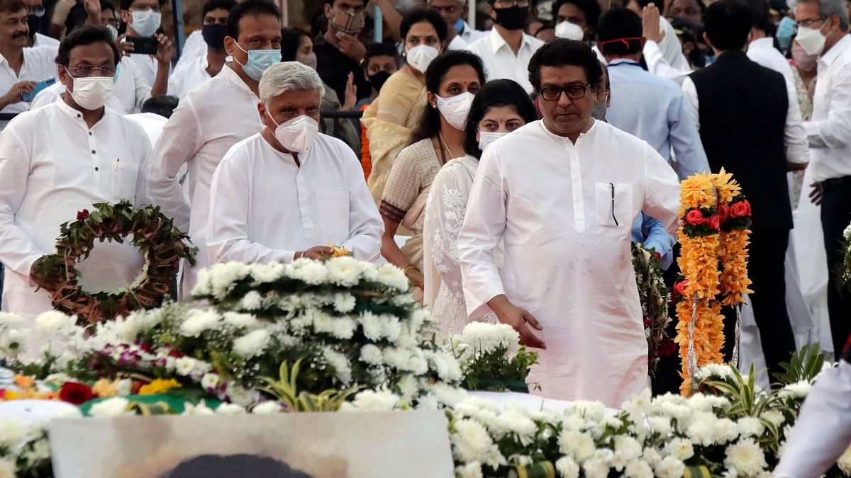 MNS chief Raj Thackeray, lyricist Javed Akhtar and other dignitaries during legendary singer Lata Mangeshkar's funeral at Shivaji Park in Mumbai. Credit: PTI Photo