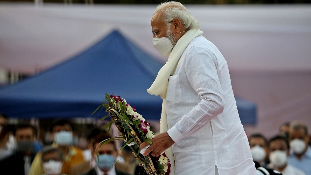 Prime Minister Narendra Modi pays his respect to Lata Mangeshkar during her funeral at Shivaji Park in Mumbai. Credit: Reuters Photo